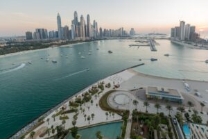 Birdseye view looking over the ocean, beaches and buildings in Dubai